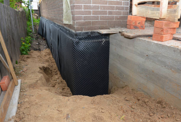 SJ Waterproofing Pros technician performing targeted Wet Basement Repair assessment in Clayton, NJ